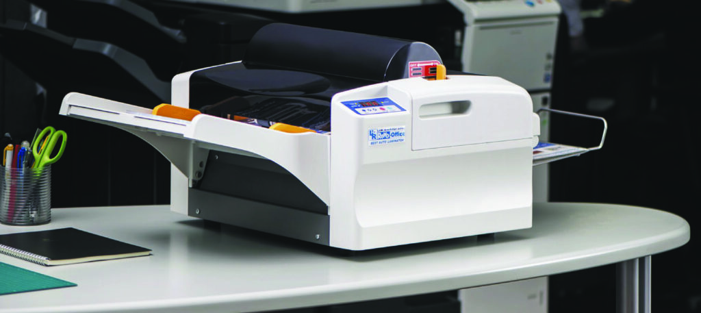 Revo Office automatic laminator on a typical desktop in office
